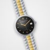 Montre automatique homme Atlas Noir Horlova – vue de trois-quarts, cadran noir soleillé, index dorés, bracelet acier bicolore